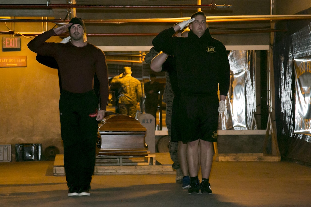 Aaron Williamson, a former body bearer and Marine Corps veteran, steps in, for "old time's sake," with the current body bearers during a drill sequence in the parking garage, Marine Barracks Washington, D.C., Feb. 25, 2016. Williamson made a special trip to D.C. to visit his old section and meet the current body bearers. Williamson is a fitness trainer, bodybuilder, and actor, who attributes his success to the values he learned while serving as a Marine. (Official Marine Corps photo by Cpl. Chi Nguyen/ Released)