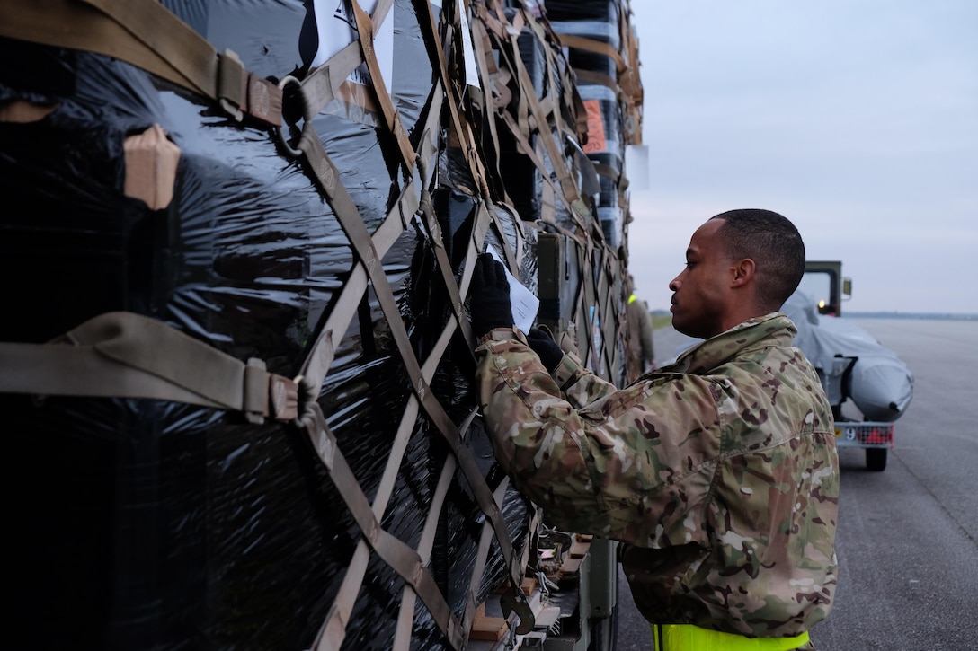U.S. Army Reserve Staff Sgt. David Howard, a load planner with Company D, 457th Civil Affairs Battalion, 7th Mission Support Command inspects a supply pallet during joint partnered movement control operations with U.S. Air Force personnel and French Air Force members Feb. 22, 2016, in support of United States Africa Command’s Operation Echo Casemate resupply mission to French military forces deployed to the Central African Republic.