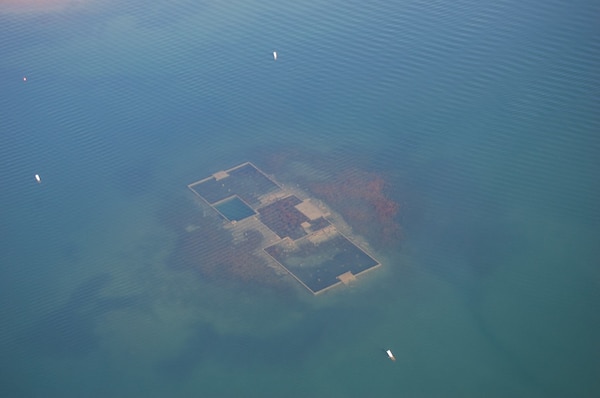 This aerial photo reveals the foundation of an old school house on the bottom of Dale Hollow Lake where the town of Willow Grove, Tenn., once stood before the U.S. Army Corps of Engineers Nashville District built Dale Hollow Dam and the lake waters rose in 1943. 