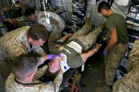 Sailors with Combat Logistics Battalion 5, 1st Marine Logistics Group, work to treat a patient during a mass casualty simulation drill during Integrated Training Exercise 2-16 aboard Marine Corps Air Ground Combat Center Twentynine Palms, Calif., Feb. 10, 2016. The drill began with taking hostile indirect-fire, resulting in multiple casualties with severe wounds. It challenged Marines and Sailors on their ability to react and work together to triage and treat patients accordingly.