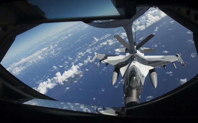 An 18th Aggressor Squadron F-16C Fighting Falcon connects to a 909th Air Refueling Squadron KC-135 Stratotanker for aerial refueling during the large force employment of exercise Cope North 16, Feb. 24, 2016, at Andersen Air Force Base, Guam. Through training exercises such as CN16, the U.S., Japan and Australian air forces develop combat capabilities, enhancing air superiority, electronic warfare, air interdiction, tactical airlift and aerial refueling. (U.S. Air Force photo by Staff Sgt. Matthew B. Fredericks/Released)