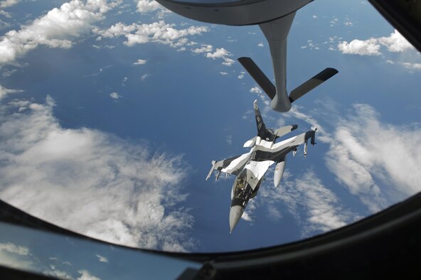 An 18th Aggressor Squadron F-16C Fighting Falcon pulls away from a 909th Air Refueling Squadron KC-135 Stratotanker after aerial refueling during the large force employment of exercise Cope North 16, Feb. 24, 2016, at Andersen Air Force Base, Guam. Through training exercises such as CN16, the U.S., Japan and Australian air forces develop combat capabilities, enhancing air superiority, electronic warfare, air interdiction, tactical airlift and aerial refueling. (U.S. Air Force photo by Staff Sgt. Matthew B. Fredericks/Released)