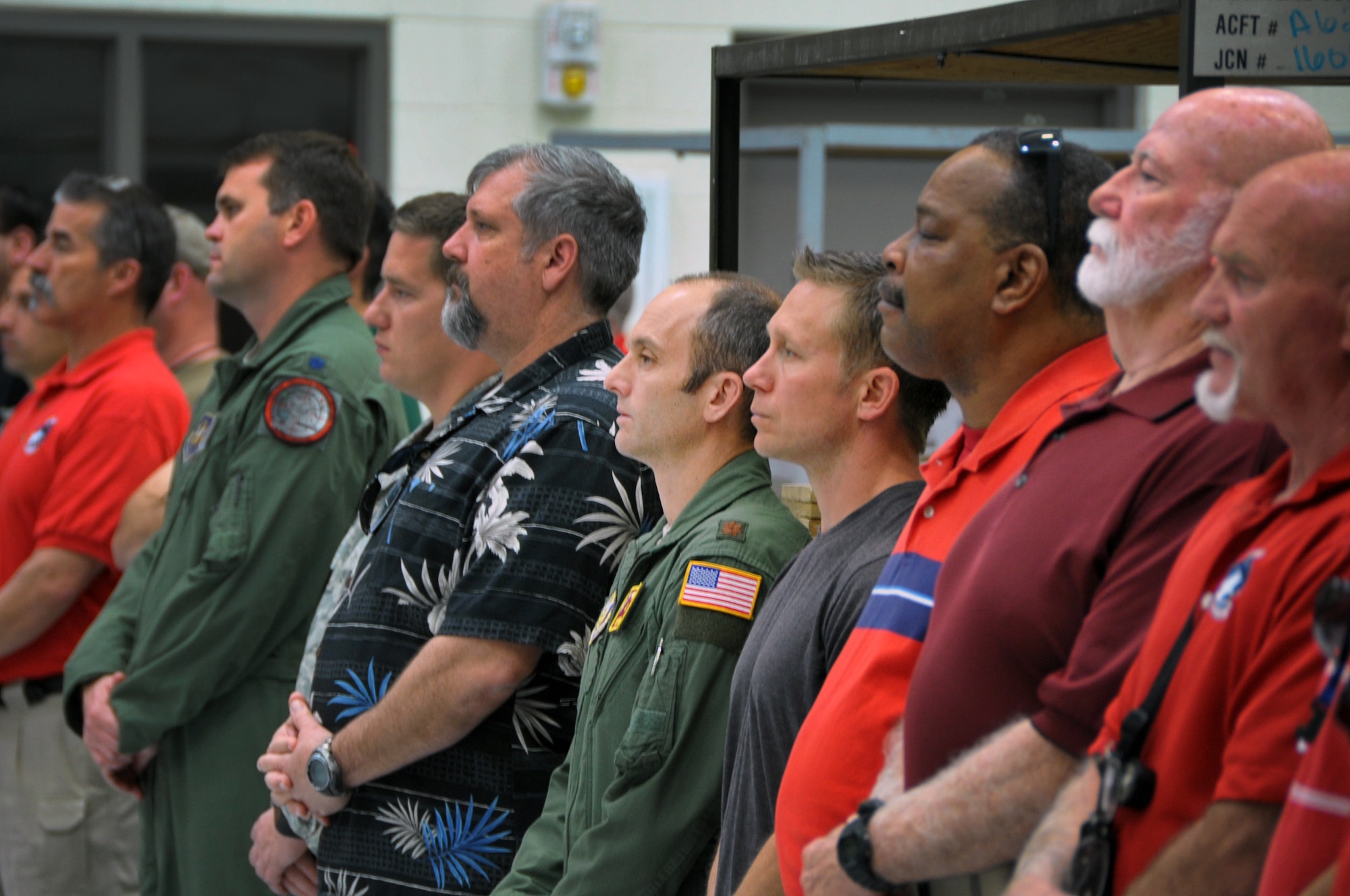 Past and present members of the 943rd Rescue Group watch as Lt. Col. Jeff “Spanky” Peterson retires after 25 years of service at Davis-Monthan Air Force Base, Ariz., Feb. 19. He was an HH-60 pilot for the 305th Rescue Squadron as a traditional Air Force reservist and the Air National Guard/Air Force Reserve’s first rescue operational test pilot at the Test Center located at Tucson International Airport. He received a Meritorious Service Medal upon his retirement. (U.S. Air Force photo by Carolyn Herrick)