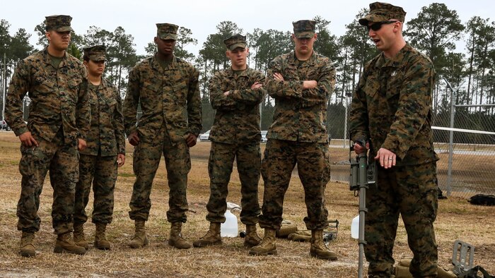 Sgt. Dereck Ford, a technician with Explosive Ordnance Disposal Company, teaches Marines with Combat Logistics Battalion 2 how to power up and recalibrate a metal detector during an improvised explosive device training exercise at Marine Corps Base Camp Lejeune, N.C., Feb. 23, 2016. CLB-2 Marines learned how to recognize signs of a buried IED and use the detector to identify the type of IED as they conducted hands-on training in preparation for their upcoming deployment with Special Purpose Marine Air Ground Task Force Crisis Response Africa. 