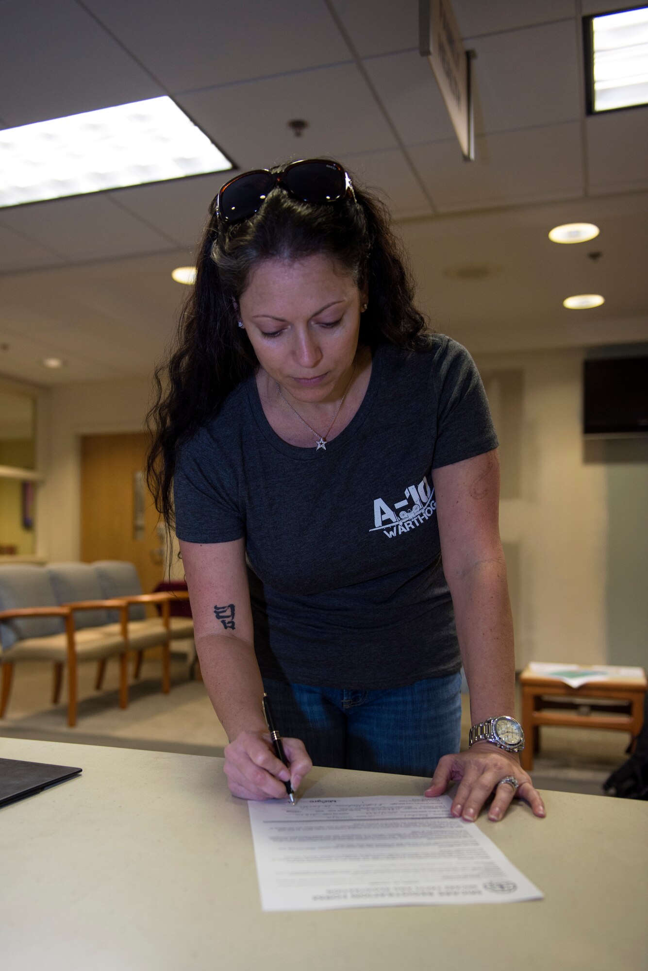 Rachel Sumja, wife of U.S. Air Force Col. Timothy Sumja, 23d Fighter Group commander, fills out a MiCare registration form, Feb. 24, 2016, at Moody Air Force Base, Ga. Department of Defense card holders can utilize MiCare through any computer, smart phone or tablet with internet access. (U.S. Air Force photo by Airman 1st Class Greg Nash/Released) 