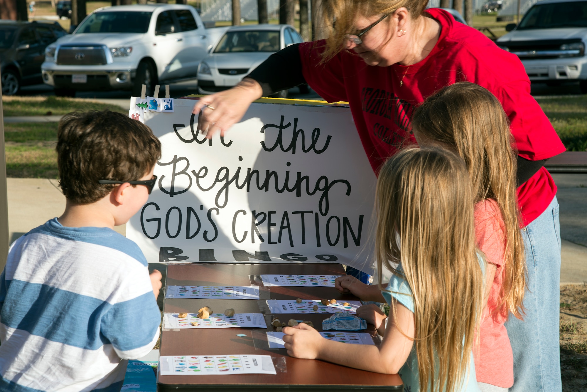 Children play a round of “God’s Creation Bingo” during the Literacy Fair, Feb. 23, 2016, at Moody Air Force Base, Ga. This version of bingo highlighted the story of creation where participants had to look on their bingo sheets for the corresponding creations. (U.S. Air Force photo by Airman 1st Class Janiqua P. Robinson/Released)
