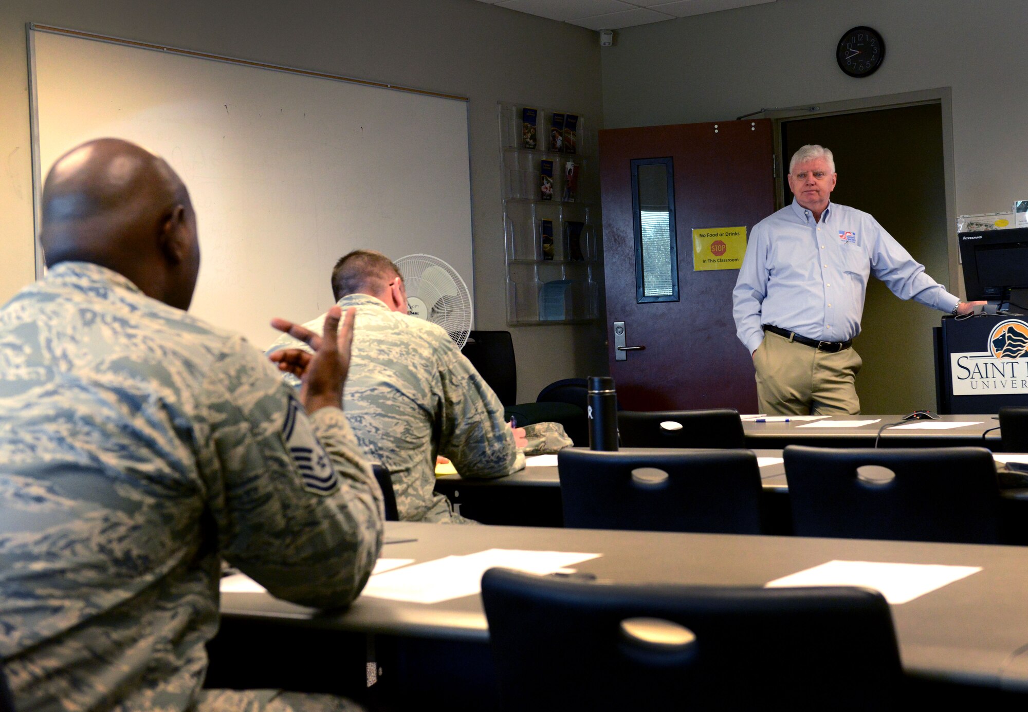 A U.S. Airman asks retired U.S. Army Maj. Rick Wise, Troops to Teachers South Carolina program manager, a question at the Troops to Teachers seminar at Shaw Air Force Base, S.C., Feb. 17, 2016. The Troops to Teachers program assists military members and their families who are transitioning into teaching careers. (U.S. Air Force photo by Airman 1st Class Destinee Dougherty) 