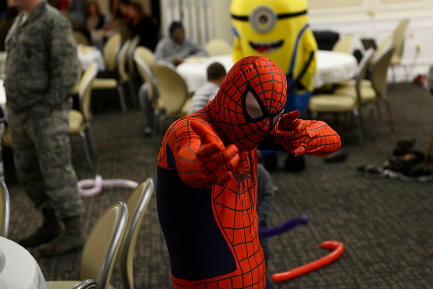A volunteer dressed as Spiderman poses for a photo during a deployed family dinner at Shaw Air Force Base, S.C., Feb. 22, 2016. Children of deployed service members were given the opportunity to do various activities including: playing with cartoon characters, playing in a bounce house, face painting, and balloon sword fights. (U.S. Air Force photo by Airman 1st Class Christopher Maldonado)