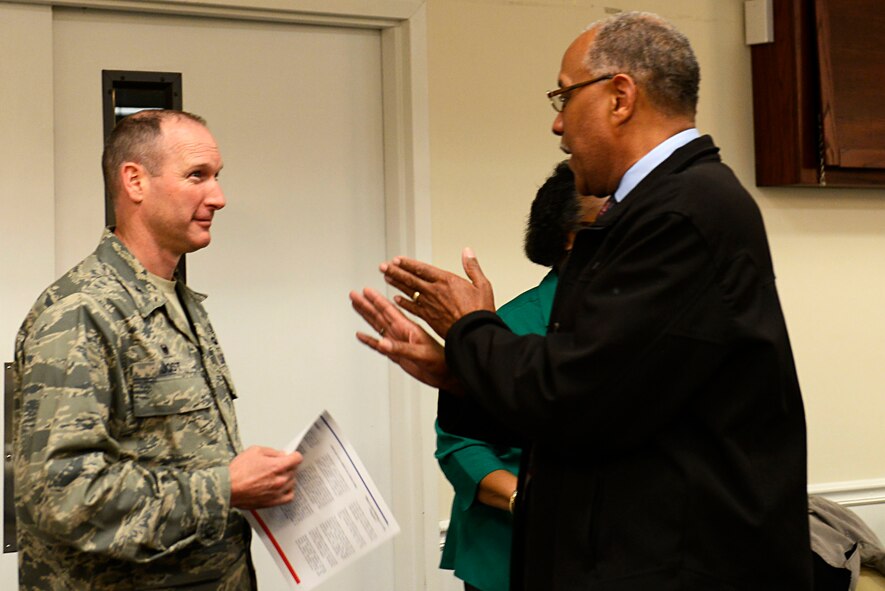 U.S. Air Force Col. Stephen Jost, 20th Fighter Wing commander, talks with South Carolina State Guard Col. William Oden, Retirees on Call Shaw coordinator, during a deployed family dinner at Shaw Air Force Base, S.C., Feb. 22, 2016. Team Shaw leadership attended the event and showed their support for deployed members by conversing with their families and program sponsors. (U.S. Air Force photo by Airman 1st Class Christopher Maldonado)