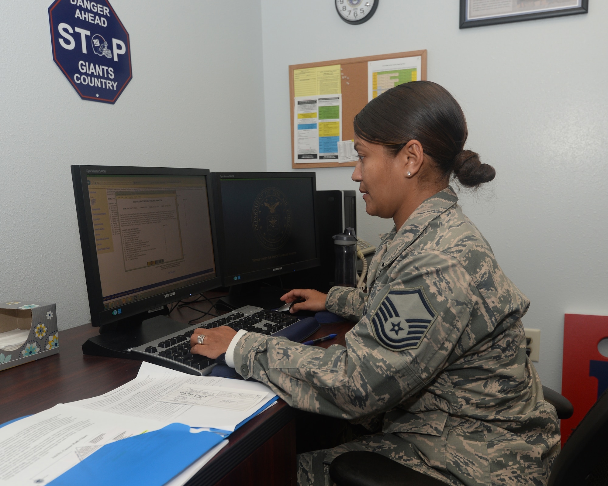 Master Sgt. Pricila Thomas, NCO academy acting-first sergeant works at her desk at Paul W. Airey NCOA Feb. 18, 2016. The NCOA coordinates with bases across the U.S. to bring active duty, Guard, and Reserve Airmen to Tyndall to learn how to manage and lead innovative enlisted troops. (U.S. Air Force photo by Airman 1st Class Cody R. Miller/Released)   