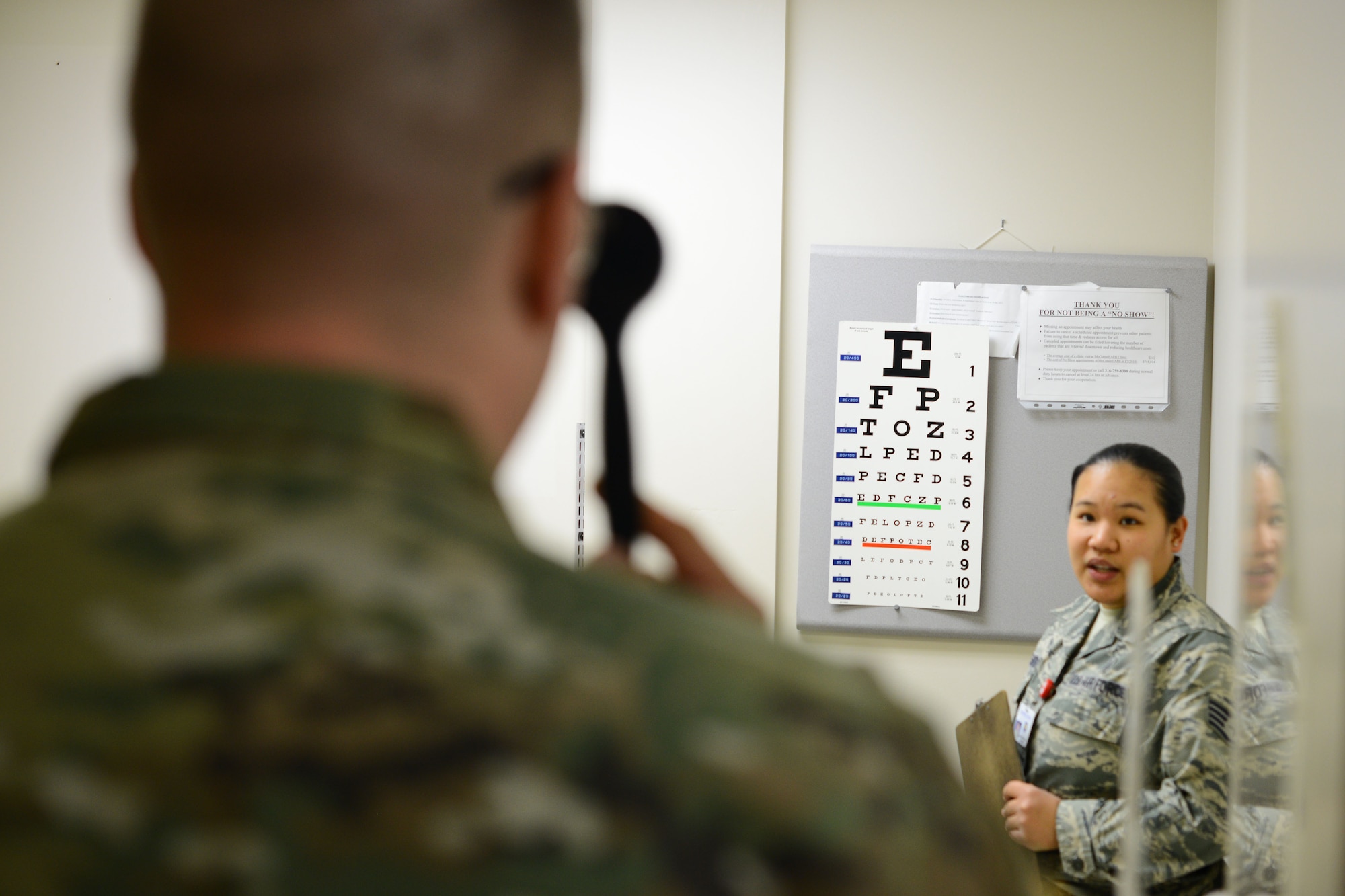 Staff Sgt. Aimee Delos Santos, 22nd Aerospace Medical Squadron optometry NCO in-charge, evaluates a patient’s vision during an eye exam, Feb. 24, 2016, at McConnell Air Force Base, Kan. Eye exams document the health and changes of service member’s vision over the years. (U.S. Air Force photo/Airman 1st Class Christopher Thornbury)