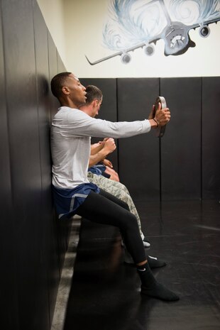 Senior Airman Jarred Alford, a Raven apprentice student, holds a weight during a three-week Phoenix Raven apprentice course Feb. 17, 2016 at Joint Base Charleston, S.C. Ravens are teams of specially trained security forces personnel dedicated to providing security for AMC aircraft transiting through high terrorist and criminal threat areas. (U.S. Air Force photo/Staff Sgt. Jared Trimarchi) 