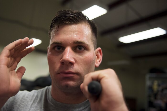 Senior Airman Kyle Creech, a Raven apprentice student,  holds a baton during a three-week Phoenix Raven apprentice course Feb. 17, 2016 at Joint Base Charleston, S.C. Ravens are teams of specially trained security forces personnel dedicated to providing security for AMC aircraft transiting through high terrorist and criminal threat areas. (U.S. Air Force photo/Staff Sgt. Jared Trimarchi) 
 
