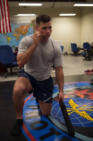 Senior Airman Kyle Creech, a Raven apprentice student,  picks up a baton during a three-week Phoenix Raven apprentice course Feb. 17, 2016 at Joint Base Charleston, S.C. Ravens are teams of specially trained security forces personnel dedicated to providing security for AMC aircraft transiting through high terrorist and criminal threat areas. (U.S. Air Force photo/Staff Sgt. Jared Trimarchi) 