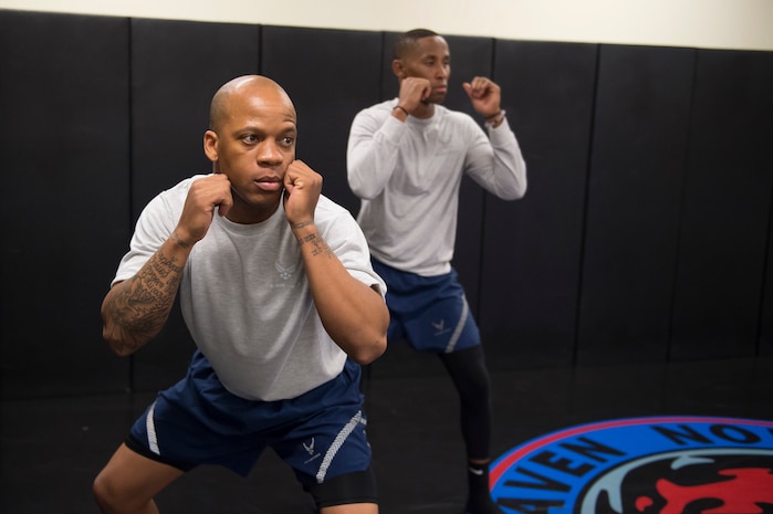 Staff Sgt. Gergory Green and Senior Airman Jarred Alford, Raven apprentice students, practice defensive positions during a three-week Phoenix Raven apprentice course Feb. 17, 2016 at Joint Base Charleston, S.C. Ravens are teams of specially trained security forces personnel dedicated to providing security for AMC aircraft transiting through high terrorist and criminal threat areas. (U.S. Air Force photo/Staff Sgt. Jared Trimarchi) 