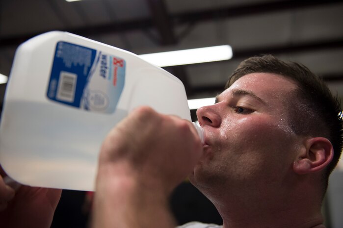 Senior Airman Kyle Creech, a Raven apprentice student,  drinks water after completing a work-out during a three-week Phoenix Raven apprentice course Feb. 17, 2016 at Joint Base Charleston, S.C. Ravens are of teams of specially trained security forces personnel dedicated to providing security for AMC aircraft transiting through high terrorist and criminal threat areas. (U.S. Air Force photo/Staff Sgt. Jared Trimarchi) 