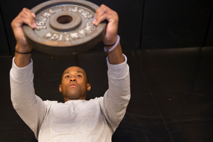 Senior Airman Jarred Alford, a Raven apprentice student,  lifts weights during a three-week Phoenix Raven apprentice course Feb. 17, 2016 at Joint Base Charleston, S.C. Ravens are teams of specially trained security forces personnel dedicated to providing security for AMC aircraft transiting through high terrorist and criminal threat areas. (U.S. Air Force photo/Staff Sgt. Jared Trimarchi) 