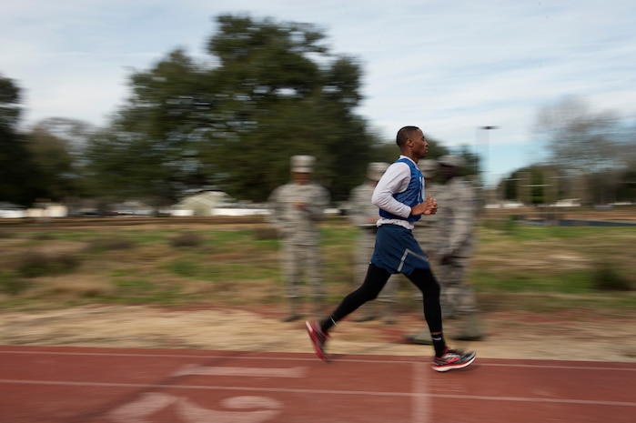 Senior Airman Jarred Alford, a Raven apprentice student, crosses the finish line during a three-week Phoenix Raven apprentice course Feb. 17, 2016 at Joint Base Charleston, S.C. Ravens are teams of specially trained security forces personnel dedicated to providing security for AMC aircraft transiting through high terrorist and criminal threat areas. (U.S. Air Force photo/Staff Sgt. Jared Trimarchi) 
