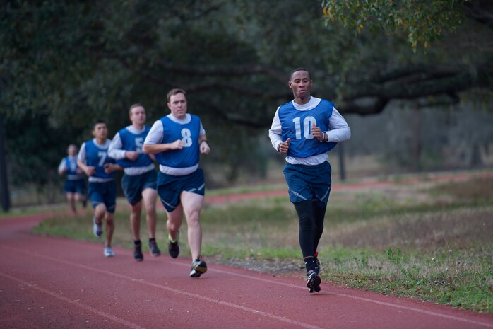 Senior Airman Jarred Alford, a Raven apprentice student, runs on a track during a three-week Phoenix Raven apprentice course Feb. 17, 2016 at Joint Base Charleston, S.C. Ravens are teams of specially trained security forces personnel dedicated to providing security for AMC aircraft transiting through high terrorist and criminal threat areas. (U.S. Air Force photo/Staff Sgt. Jared Trimarchi) 