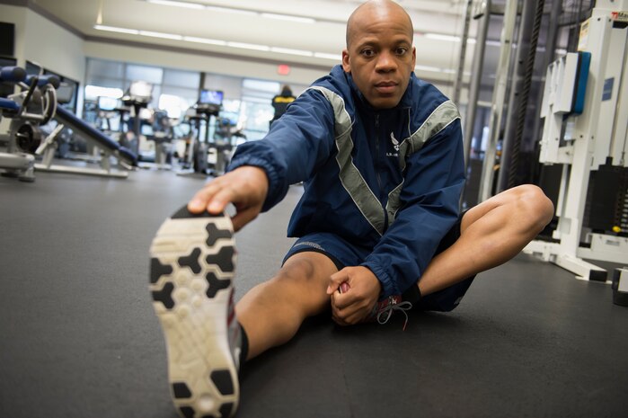Staff Sgt. Gregory Green, a Raven apprentice student, stretches before taking an Air Force physical training test during a three-week Phoenix Raven apprentice course Feb. 17, 2016 at Joint Base Charleston, S.C. Ravens are teams of specially trained security forces personnel dedicated to providing security for AMC aircraft transiting through high terrorist and criminal threat areas. (U.S. Air Force photo/Staff Sgt. Jared Trimarchi) 