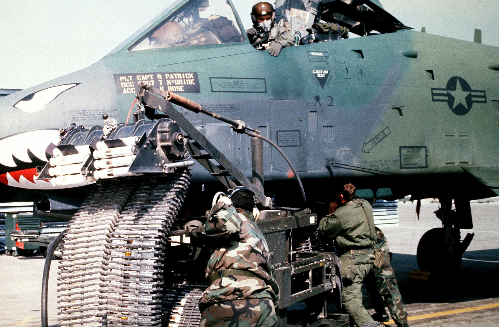 Munitions specialists from the 23rd Tactical Fighter Wing, England Air Force Base, La., load 30 mm rounds of ammunition into an A-10A Thunderbolt II attack aircraft for its GAU-8/A Avenger cannon prior to a sortie in support of Operation Desert Storm. (Courtesy photo)