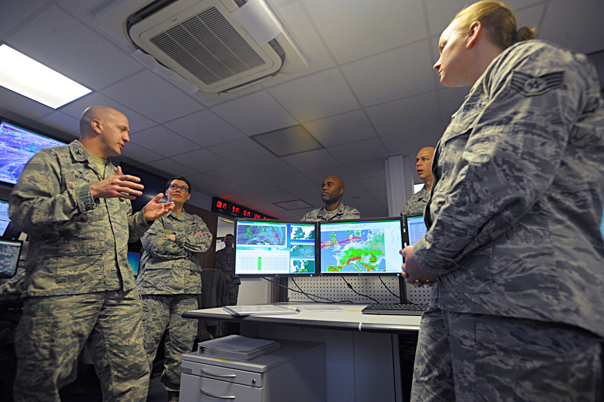 Col. Gerald Donohue, 86th Operations Group commander, speaks to Airmen of the 21st Operational Weather Squadron during a tour of the squadron Feb. 22, 2016, at Kapaun Air Station, Germany. Donohue and Chief Master Sgt. Amber Mitchell, 86th OG superintendent, toured the 21st OWS to learn about the capabilities they provide not only to Ramstein Air Base but to all Department of Defense operations within the U.S. European Command and U.S. Africa Command’s areas of responsibility. (U.S. Air Force photo/Staff Sgt. Timothy Moore)