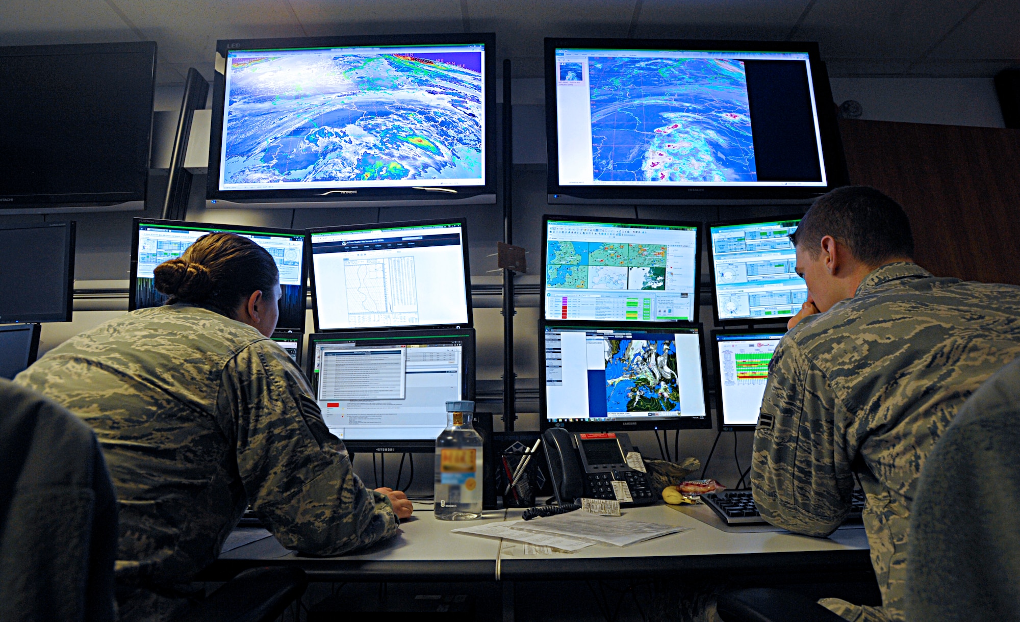 Senior Airman Amanda Diaz, left, and Airman 1st Class Aaron Wolak, both 21st Operational Weather Squadron weather forecasters, monitor the weather patterns of northern Europe Feb. 22, 2016, at Kapaun Air Station, Germany. The mission of the 21st OWS is to provide timely and accurate forecast products to customers across the areas of responsibility of U.S. European Command and U.S. Africa Command. (U.S. Air Force photo/Staff Sgt. Timothy Moore) 