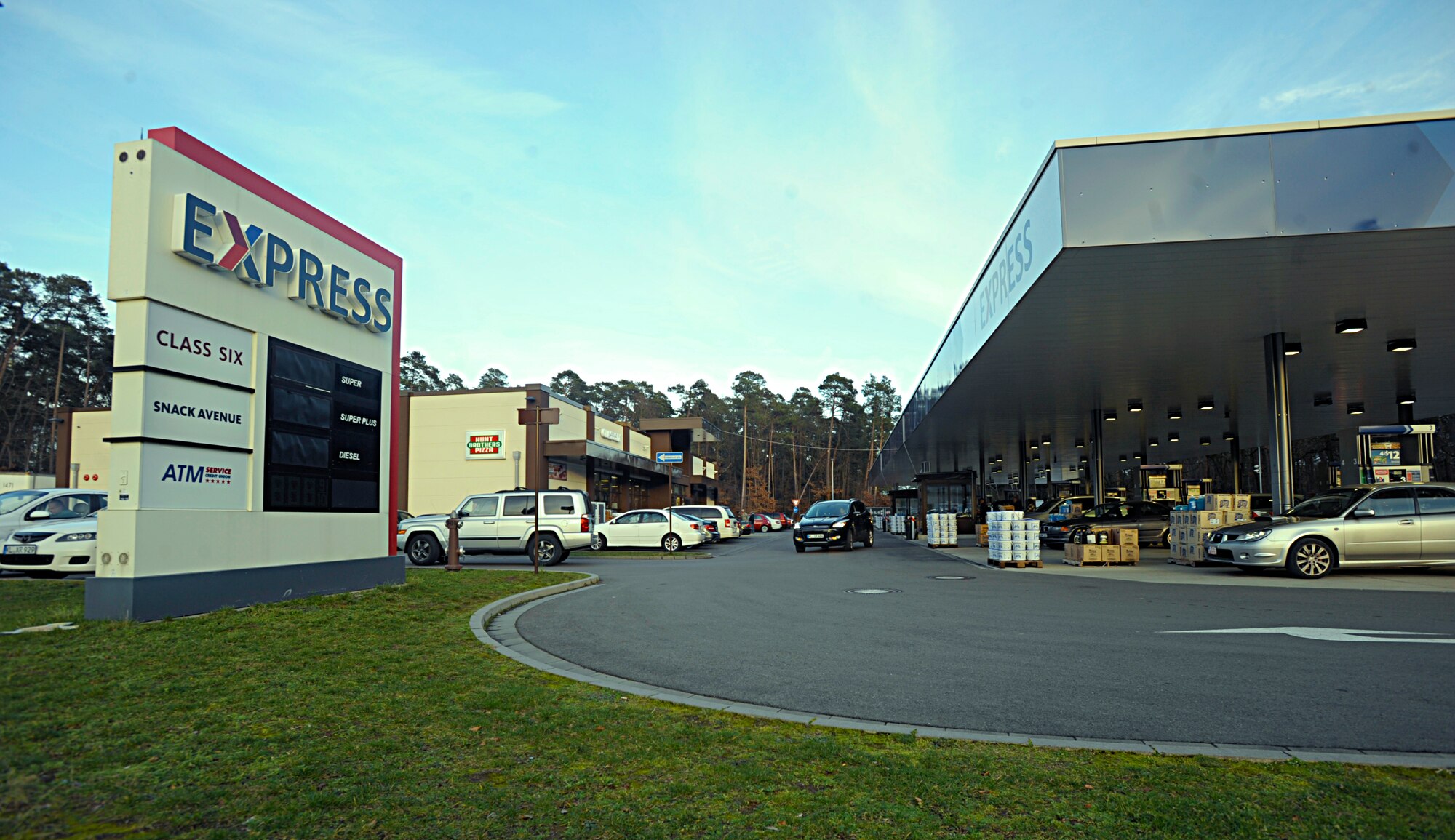 The parking lot of the Ramstein Express, better known as the shoppette, is scheduled to undergo construction beginning March 1, 2016. The first phase of the two-phase project will turn the current exit of the parking lot into a right-turn only exit as well as place a barricade in the center of the road running alongside the parking lot. The second phase will extend the barricade as well as create an additional exit, which will allow gas-and-go patrons to exit the area without going into the shoppette parking lot. (U.S. Air Force photo/Staff Sgt. Timothy Moore)