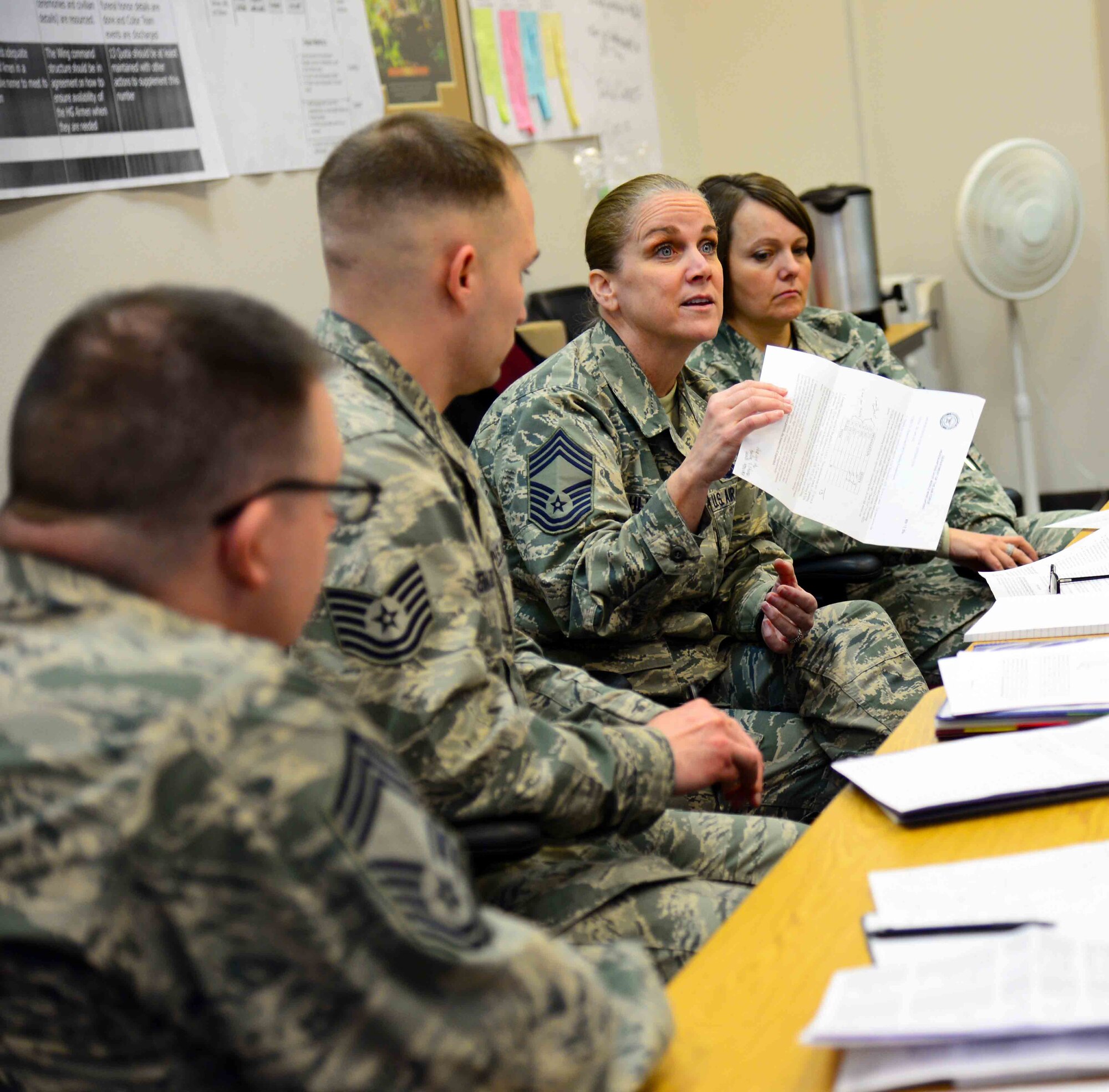 Chief Master Sgt. Lisa Dahlinger, 341st Operations Group superintendent, center right, suggests changes during a Continuous Process Improvement event Feb. 25, 2016, at Malmstrom Air Force Base, Mont. CPI team members discussed the issues associated with the 341st Missile Wing honor guard program. (U.S. Air Force photo/Airman 1st Class Magen M. Reeves)