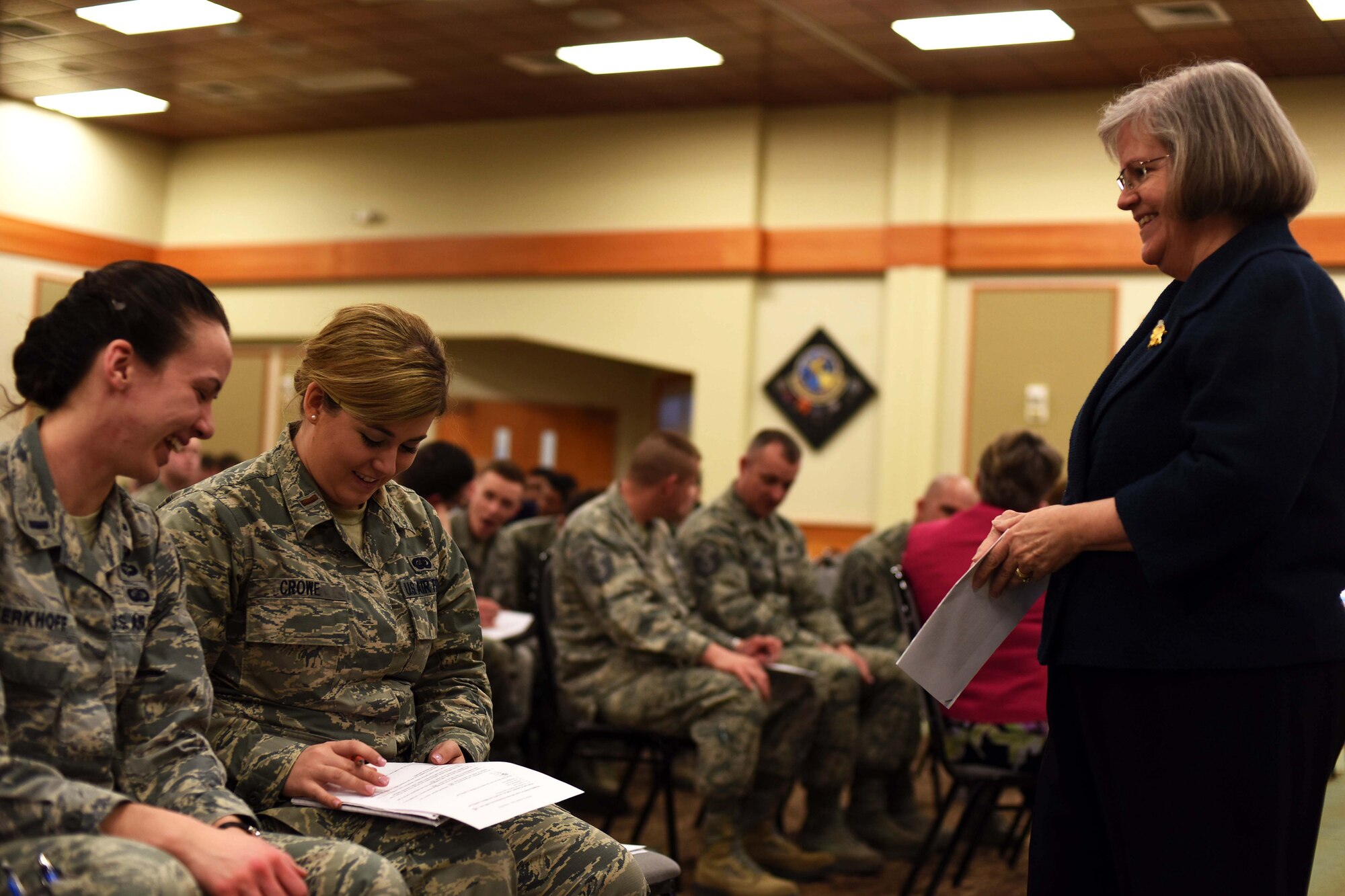 Holly Petraeus, Assistant Director of the Consumer Financial Protection Bureau, right, jokes with Team Malmstrom members during a town hall meeting at the Malmstrom Air Force Base Grizzly Bend Feb. 23, 2016. Petraeus spoke with enlisted and commissioned military members about consumer financial protection during the meeting. (U.S. Air Force photo/Airman Collin Schmidt)
