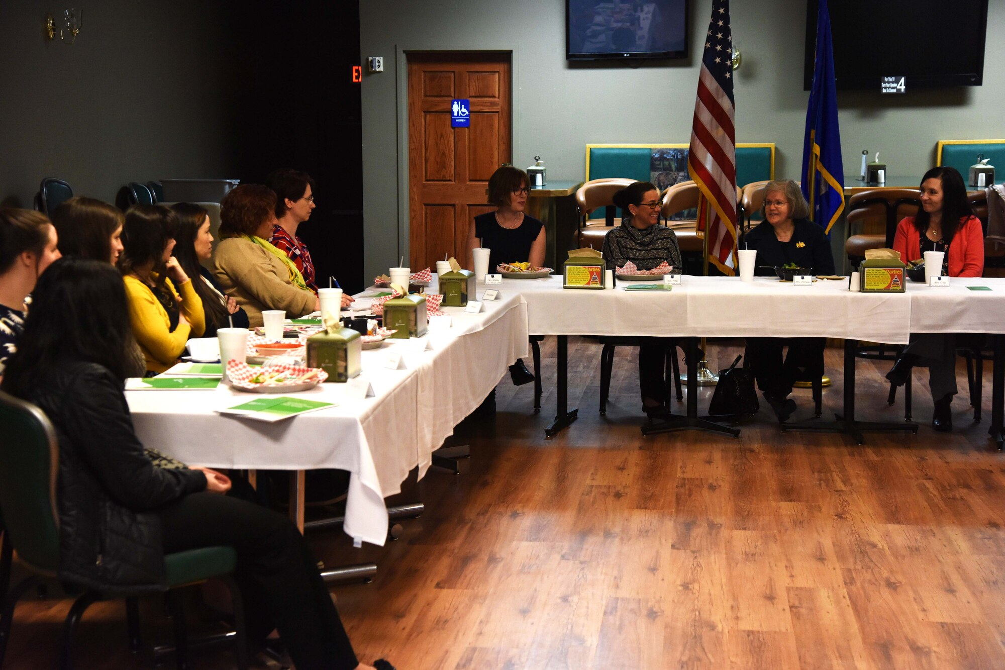 Holly Petraeus, Assistant Director of the Consumer Financial Protection Bureau, center right, speaks with military key spouses during lunch at the Malmstrom Air Force Base Aces High Bowling Center Feb. 23, 2016. Petraeus spoke with the spouses about financial protection while listening to their stories about life as military spouses. (U.S. Air Force photo/Airman Collin Schmidt)