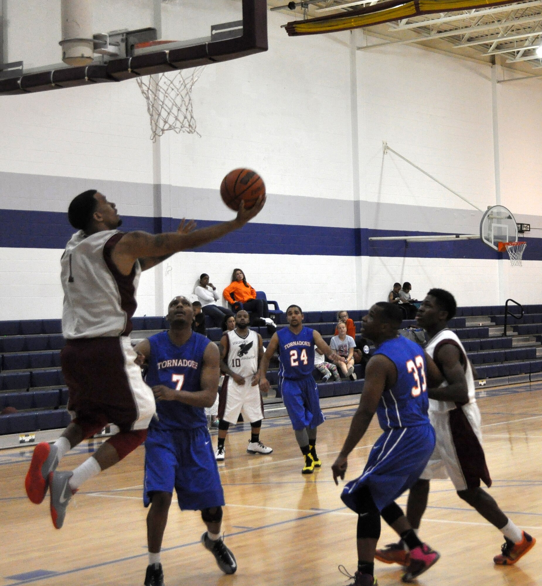 Tinker Hawks guard Ryan Florie lets a reverse layup fly in the Feb. 21 game against the McConnell AFB Tornadoes at the Gerrity Fitness Center. The Hawks won 80-65 and finished with the best record, 3-1, in the three-team conference play over the weekend. (Air Force photo by John Parker/Released)