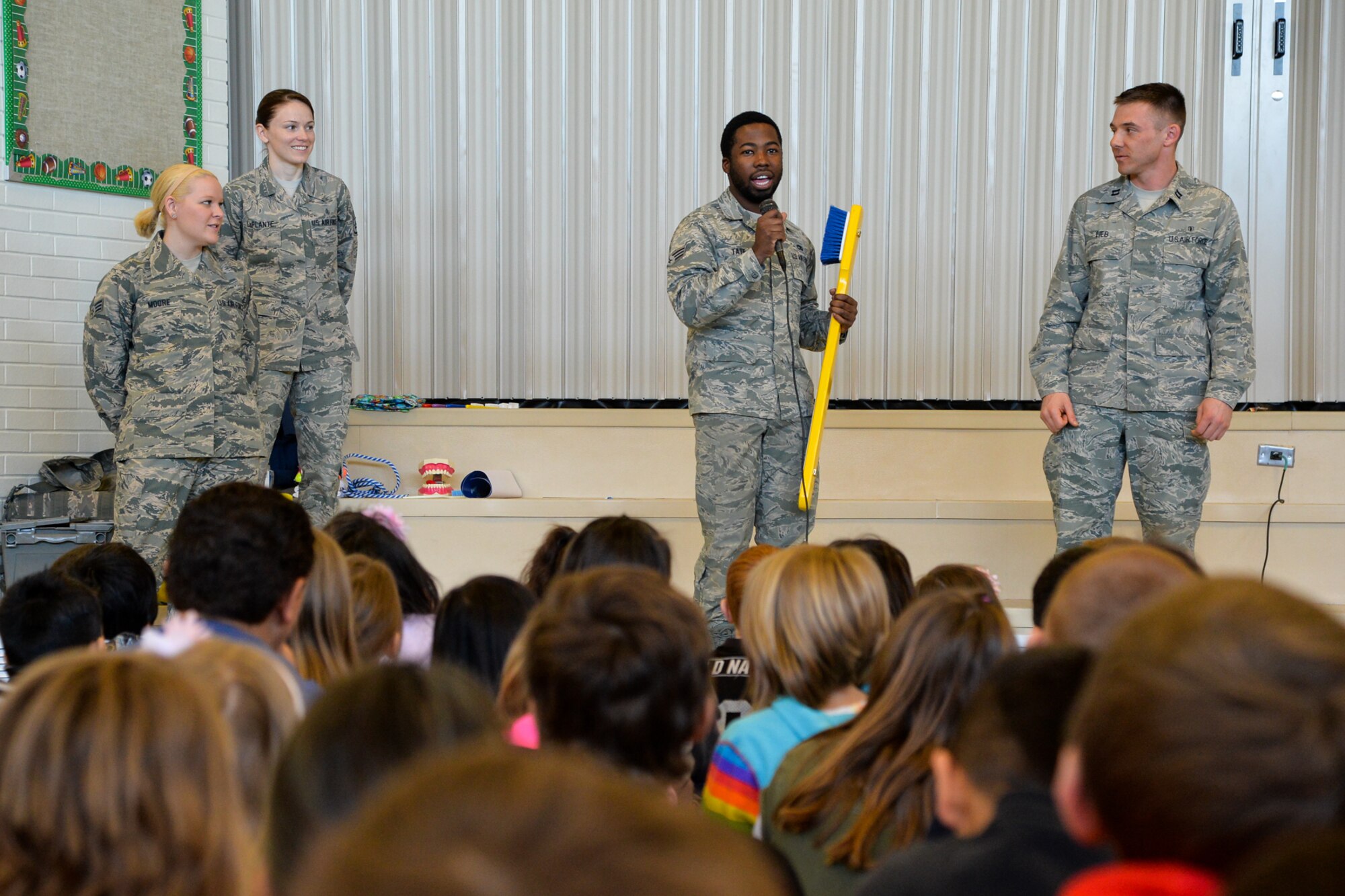 Senior Airman Douglas Tate, 75th Dental Squadron, speaks to students Feb. 25 at Doxey Elementary School, Sunset, Utah. Airmen from the 75th DS, in support of Children’s Dental Health Month, visited local schools and educated over 1,000 children about healthy eating, proper brushing, flossing and the importance of visiting a dentist regularly. (U.S. Air Force photo by R. Nial Bradshaw)