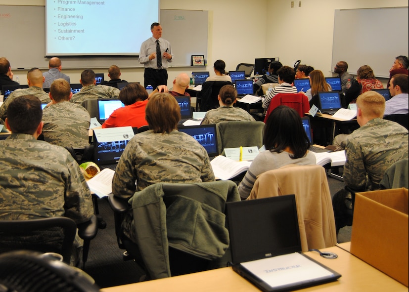 Paul Joyce, instructor at the Air Force Institute of Technology School of
Systems and Logistics, teaches students in the Mission Ready Contracting Officer Course at Wright-Patterson Air Force Base. (U.S. Air Force photo/Dennis Stewart)
