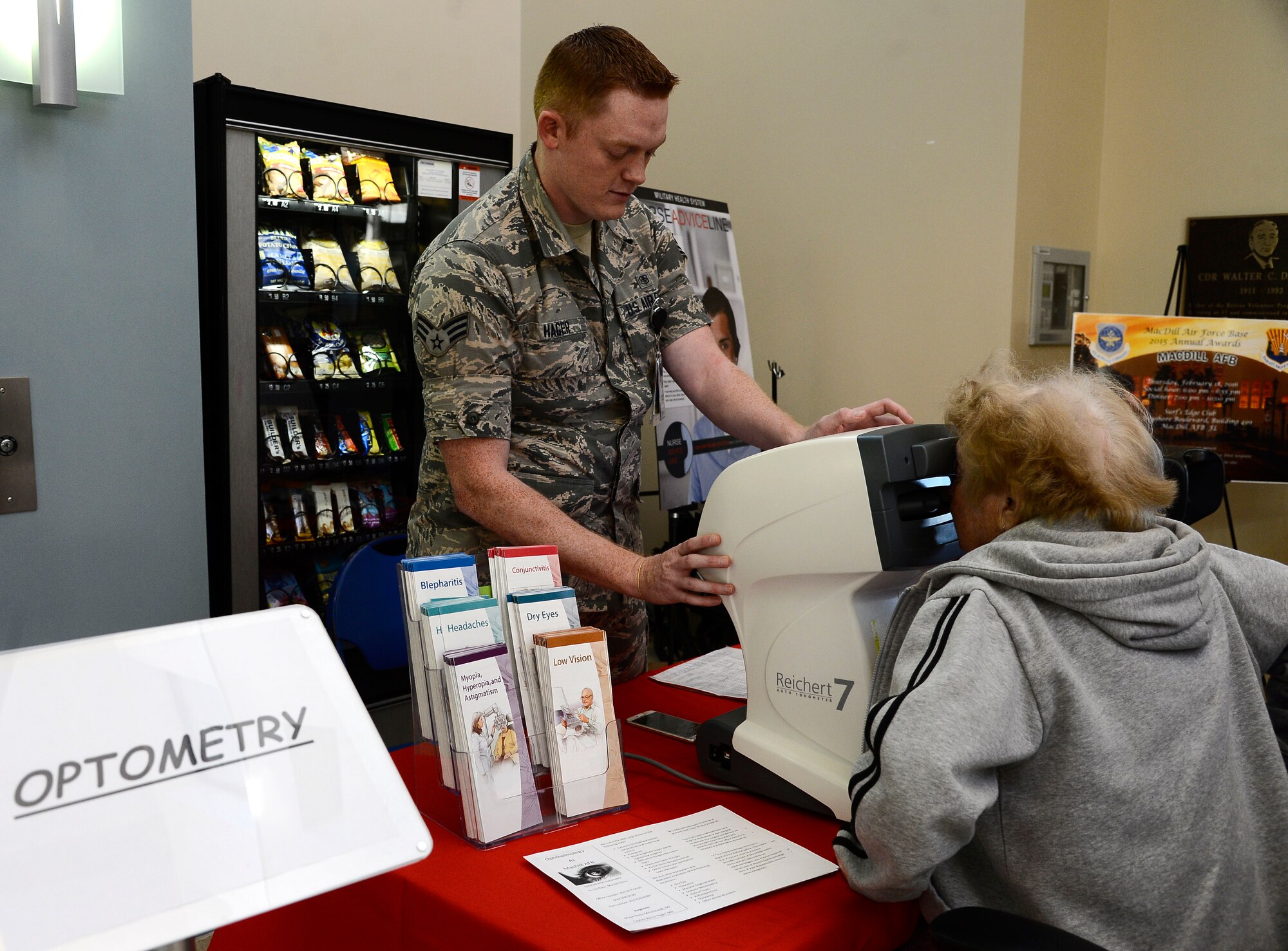Senior Airman Nicholas Hager, optometry technician assigned to the 6th Aerospace Medical Support Squadron, checks a patient’s eye pressure at the 6th Medical Group clinic during Retiree Appreciation Day at MacDill Air Force Base, Fla., Feb. 11, 2016. The clinic opened its doors to units from around base and hosted Retiree Appreciation Day for retirees from every branch of service. (U.S. Air Force photo by Senior Airman Tori Schultz) 

