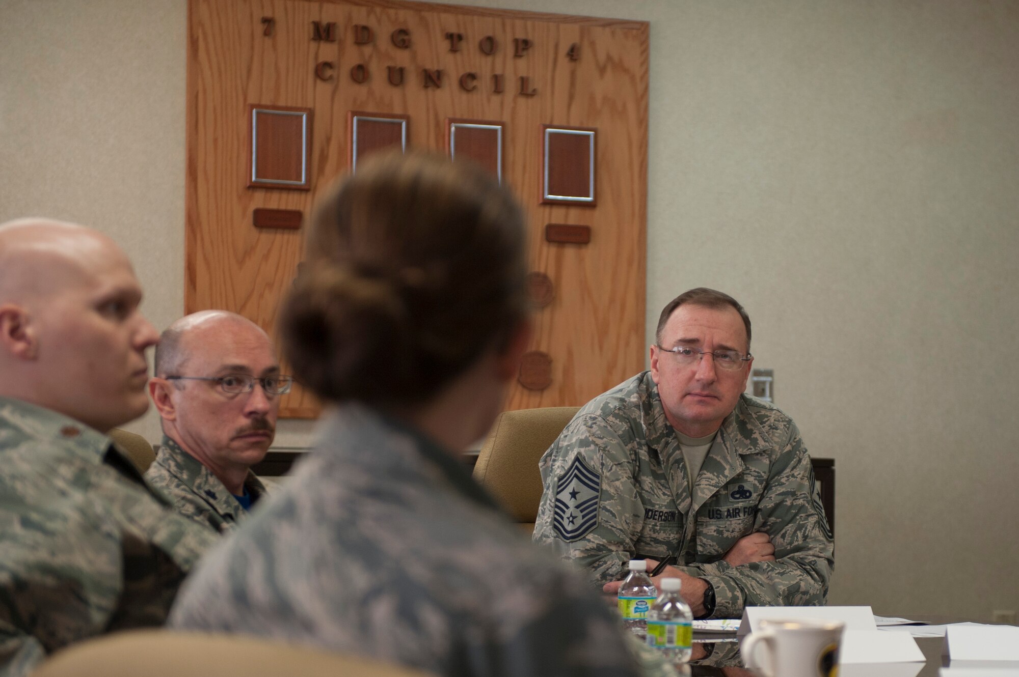 Members of the 7th Medical Group speak with Chief Master Sgt. Marty Anderson Feb. 12, 2016, at Dyess Air Force Base, Texas. Medical personnel used the opportunity to highlight the accomplishments made by their Airmen, as well as answer questions posed by the chief. (U.S. Air Force photo by Airman Quay Drawdy/Released)