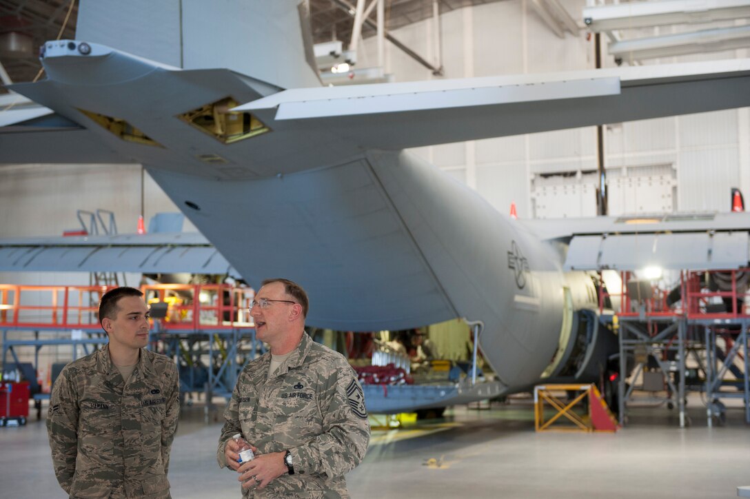 U.S. Air Force Airman Curtis Hamann, a loadmaster with the 317th Aircraft Maintenance Squadron (left) speaks to U.S. Air Force Chief Master Sgt. Marty Anderson, 8th Air Force command chief, Feb. 10, 2016, at Dyess Air Force Base, Texas. Anderson was given a tour of Dyess and met with Airmen all across the installation. (U.S. Air Force photo by Airman Quay Drawdy/Released)