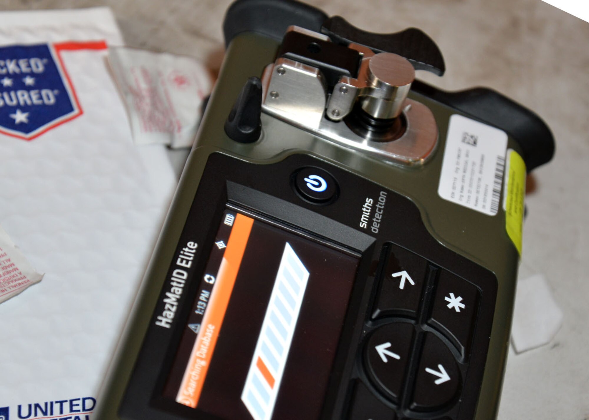 A HazMat ID Elite handheld detector analyzes a simulated unknown substance during a joint training exercise Feb. 10, 2016, on RAF Mildenhall, England. The handheld detector can identify the presence of chemical agents in liquid or solid form in approximately one minute or less. It’s so advanced, it can tell responders exactly what agent they are dealing with even if there is more than one substance present. Responders from the 100th Civil Engineer Squadron Fire Department, 100th CES Emergency Management flight, 48th CES Emergency Management flight, and 48th Aerospace Medicine Squadron Bioenvironmental Engineering flight joined forces to train on responding to a suspicious package containing hazardous materials. (U.S. Air Force photo by Karen Abeyasekere/Released)