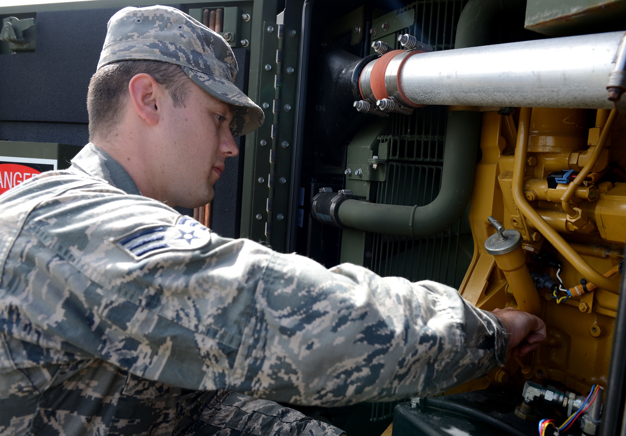 Senior Airman Michael Eyres, 644th Combat Communications Squadron power production technician, performs an inspection on a generator responsible for providing air conditioning to tents during exercise Cope North 16 Feb. 16, 2016, at Andersen Air Force Base, Guam. The 644th CBCS played a huge role in providing all the necessary communication equipment and tents for Air Force and partner nations’ mobility assets during a humanitarian assistance and disaster relief exercise. (U.S. Air Force photo/Airman 1st Class Arielle Vasquez)
