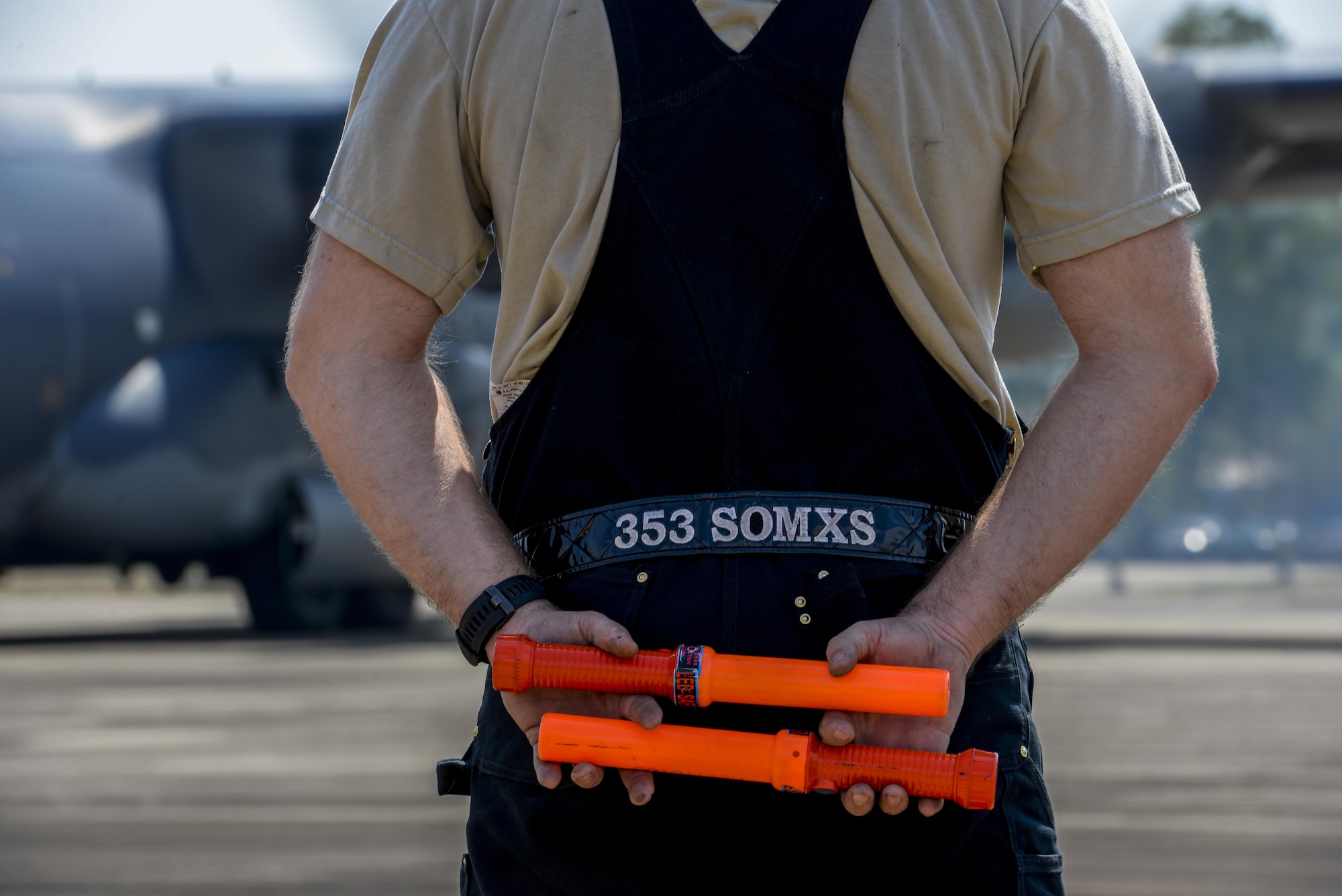 A member of the 353rd Special Operations Maintenance Squadron prepares to marshal an MC-130H from the 1st Special Operations Squadron during exercise Cobra Gold in Udon Thani, Thailand, Feb. 8, 2016. Cobra Gold 16, in its 35th iteration, is designed to advance regional security and ensure effective responses to regional crises by bringing together a robust combined task force from partner nations sharing common goals and security commitments in the Indo-Asia-Pacific region. (U.S. Air Force photo by Senior Airman Stephen G. Eigel)