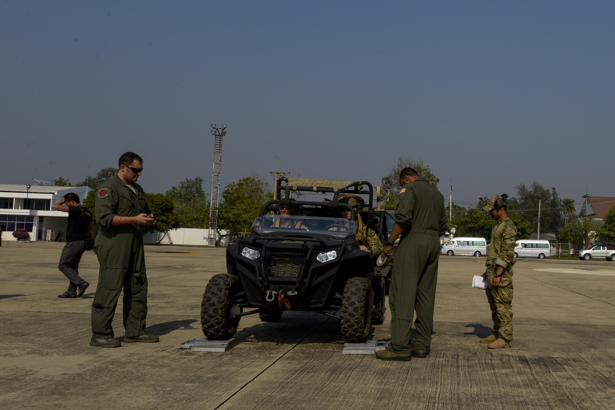 Loadmasters from the 1st Special Operations Squadron finish final checks on vehicles before loading them onto the aircraft for take-off during exercise Cobra Gold Feb. 10, 2016, Udon Thani, Thailand. We have been treaty partners with Thailand for more than 182 years and treaty allies for more than sixty years. (U.S. Air Force photo by Senior Airman Stephen G. Eigel)