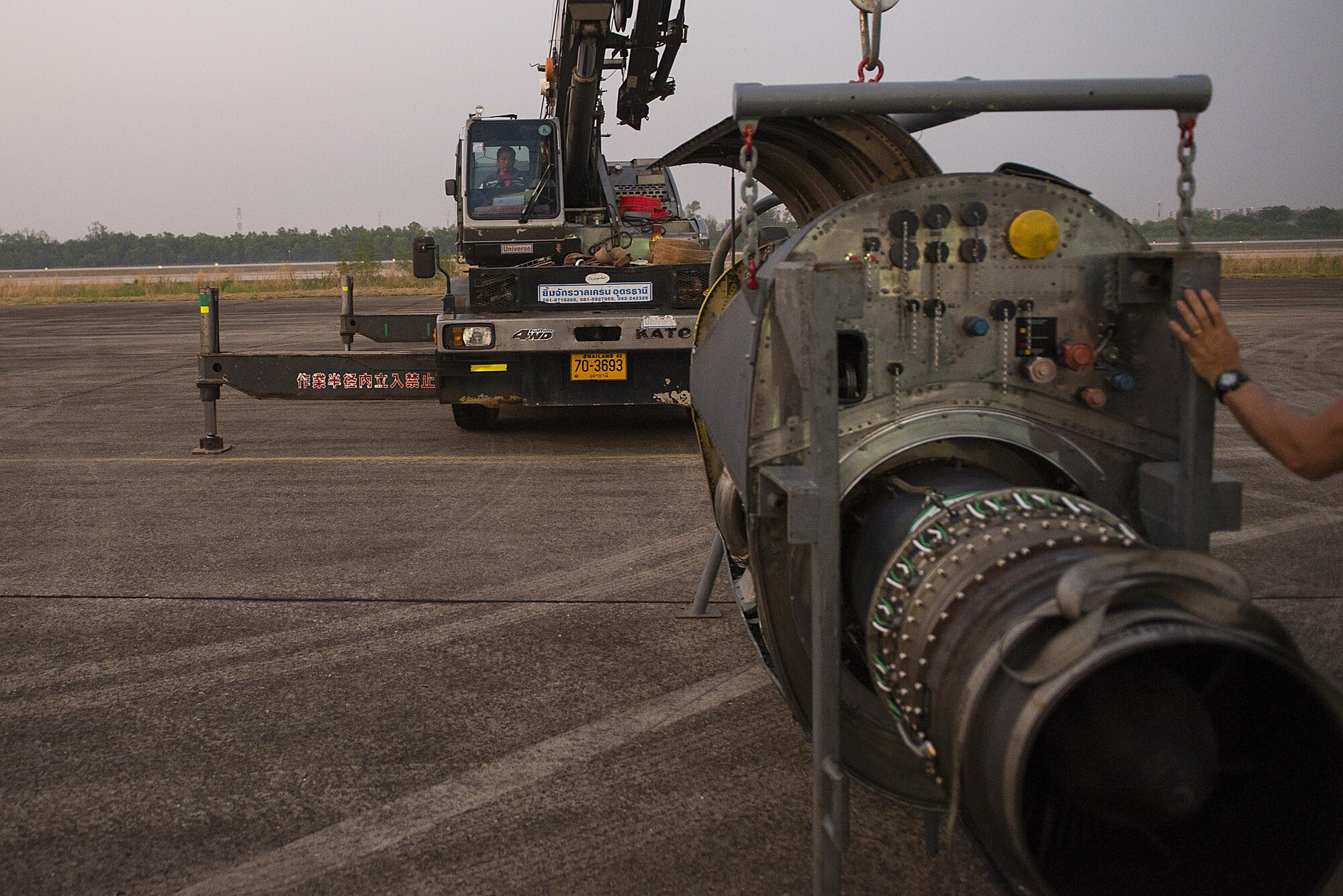 Members of the 353rd Special Operations Maintenance Squadron preform an engine change for an MC-130H at exercise Cobra Gold, Udon Thani, Thailand, Feb. 14, 2016. It took a maintenance team two days to remove the old engine and install the new engine. (U.S. Air Force photo by Senior Airman Stephen G. Eigel)