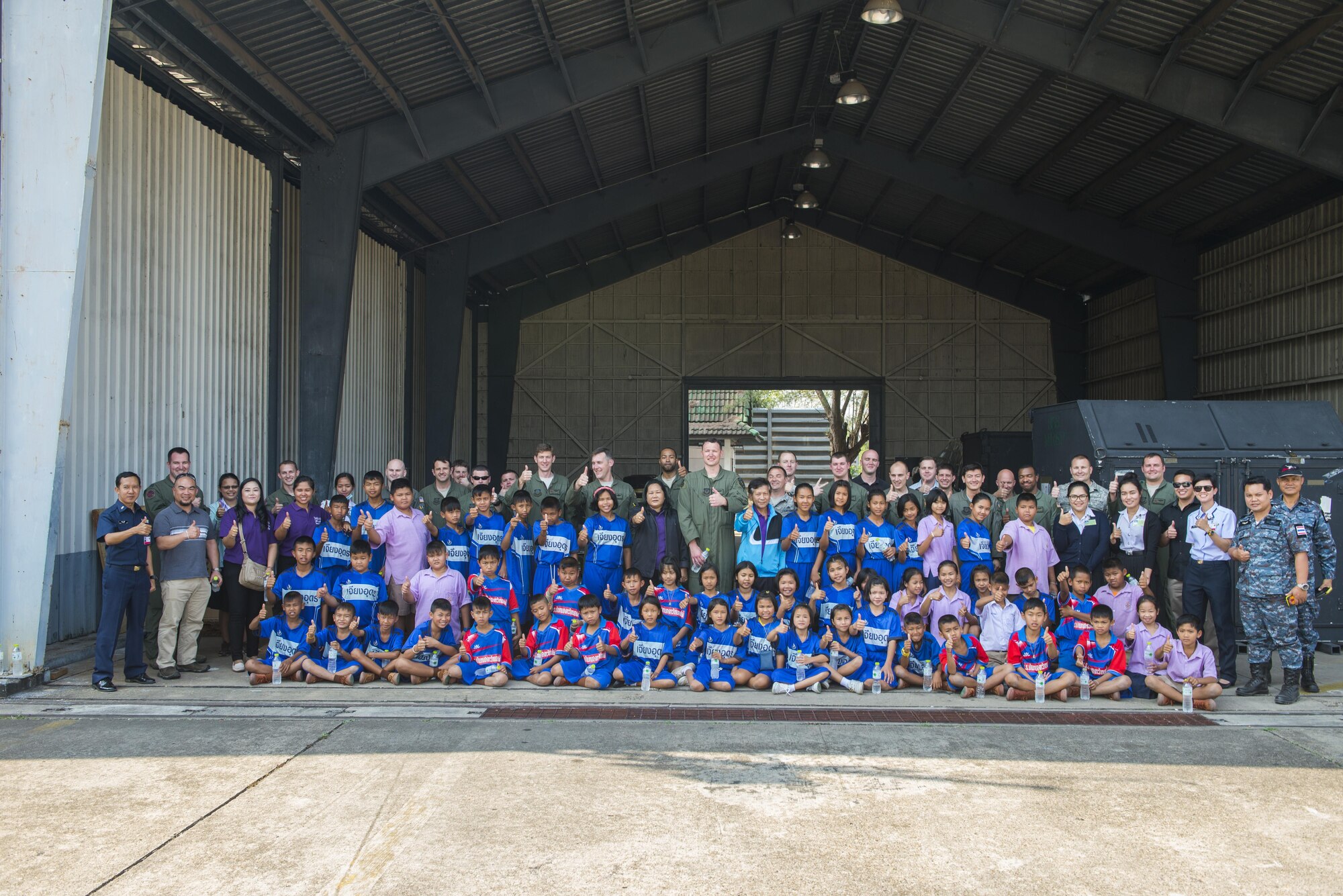 Members of the 353rd Special Operations Group take a group photo with students from Nong-no Wittayakan school during exercise Cobra Gold 16, Udon Thani, Thailand, Feb. 16, 2016. Cobra Gold 16 demonstrates the commitment of the Kingdom of Thailand and the United States to our long-standing alliance and regional partnership toward advancing prosperity and security in the Indo-Asia-Pacific region. (U.S. Air Force photo by Senior Airman Stephen G. Eigel)