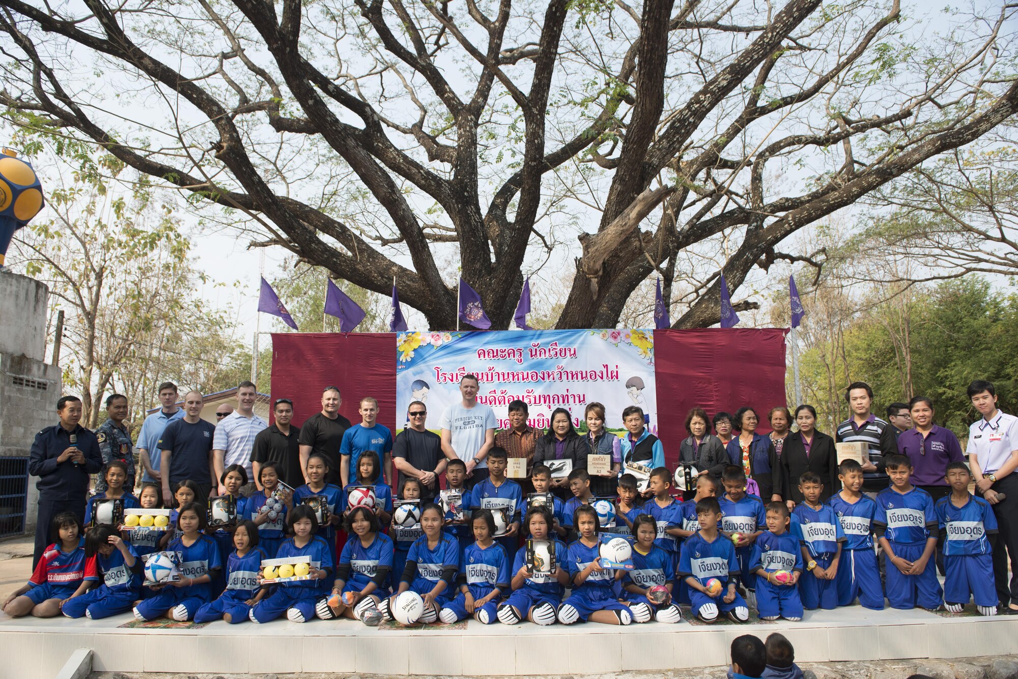 Members of the 353rd Special Operations Group take a group photo with students from Nong-no Wittayakan school during exercise Cobra Gold 16, Udon Thani, Thailand, Feb. 16, 2016. Thailand and the United States are committed to working together in support of peace and security in the region. (U.S. Air Force photo by Senior Airman Stephen G. Eigel)