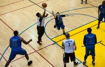 The 8th Security Forces Squadron “Defenders” (wearing blue) play against the 8th Fighter Wing Staff “Agency” during an intramural basketball championship at Kunsan Air Base, Republic of Korea, Feb. 26, 2016. The Defenders beat the Agency 75-39. (U.S. Air Force photo by Staff Sgt. Nick Wilson/Released)