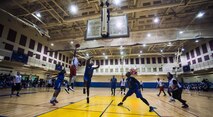 The 8th Security Forces Squadron “Defenders” (wearing blue) play against the 8th Fighter Wing Staff “Agency” during an intramural basketball championship at Kunsan Air Base, Republic of Korea, Feb. 26, 2016. The Defenders beat the Agency 75-39. (U.S. Air Force photo by Staff Sgt. Nick Wilson/Released)