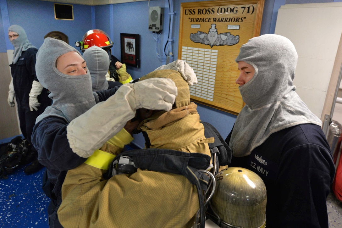 Sailors prepare their firefighting equipment before participating in a fire drill aboard the USS Ross in the Mediterranean Sea, Feb. 19, 2016. The Ross, an Arleigh Burke-class guided-missile destroyer, forward deployed to Rota, Spain, is conducting a routine patrol in the U.S. 6th Fleet area of operations in support of U.S. national security interests in Europe. Navy photo by Petty Officer 2nd Class Justin Stumberg