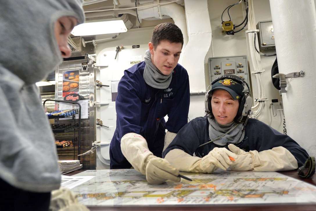 Sailors review floor plans before participating in a fire drill aboard the USS Ross in the Mediterranean Sea, Feb. 19, 2016. The Ross is on patrol supporting U.S. national security interests in Europe. Navy photo by Petty Officer 2nd Class Justin Stumberg