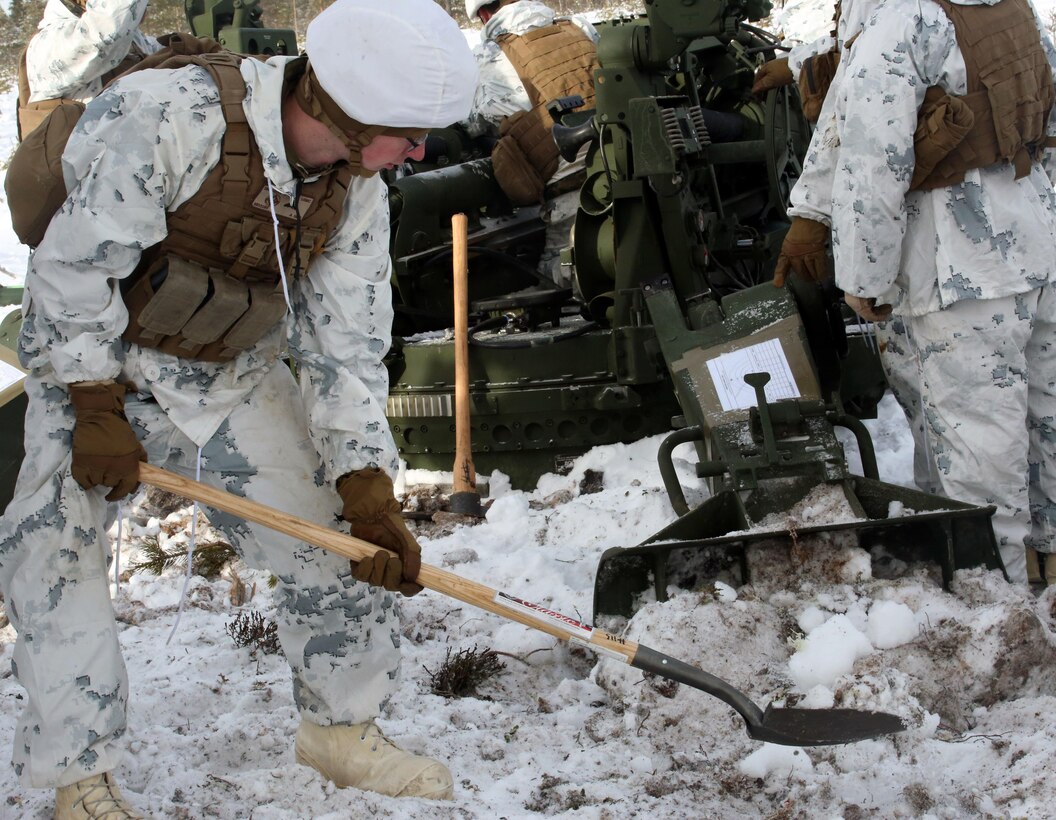 Cpl. Stanley Ptak, section chief for Combined Arms Company, buries a Howitzer spade to increase stability during a live-fire shoot in Rena, Norway, Feb. 23, 2016, in preparation for Exercise Cold Response 16. The exercise will include 12 NATO allies and partner nations, and approximately 16,000 troops. The Marines will provide indirect-fire support for infantry units during the exercise.