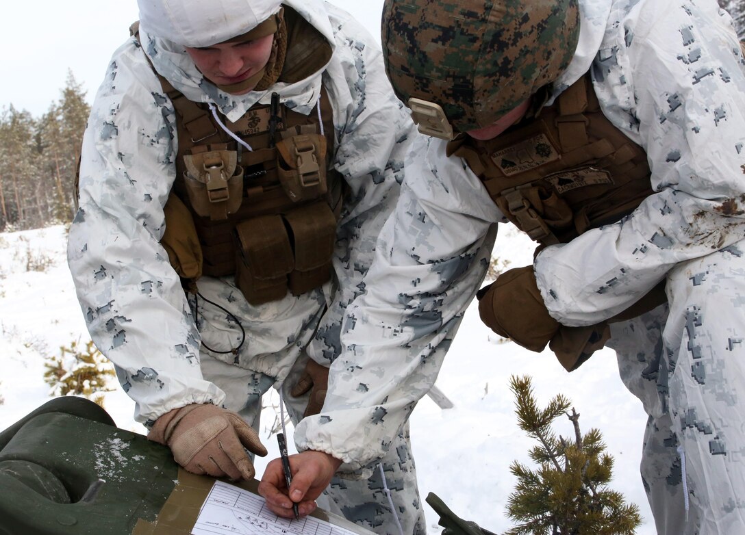 Cpl. Brennan Ullrich (left), and Cpl. Robert Maharrey, cannoneers with Combined Arms Company, fill out an M777 Howitzer range card before a live-fire shoot in Rena, Norway, Feb. 23, 2016, in preparation for Exercise Cold Response 16. The exercise will include 12 NATO allies and partner nations, and approximately 16,000 troops.